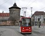 GT 6N Nr.2006 fhrt an die Haltestelle am Hauptbahnhof,am 04.04.2011. Im Hintergrund ist ein Turm der historischen Stadtbefestigung zu sehen.