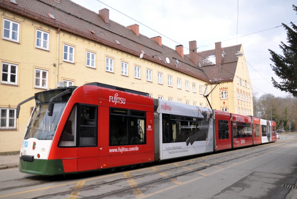 NF 8 Combino Nr. 829 mit Fujitsu-Werbung in der Margaretenstrasse in Augsburg am 15.03.2013.